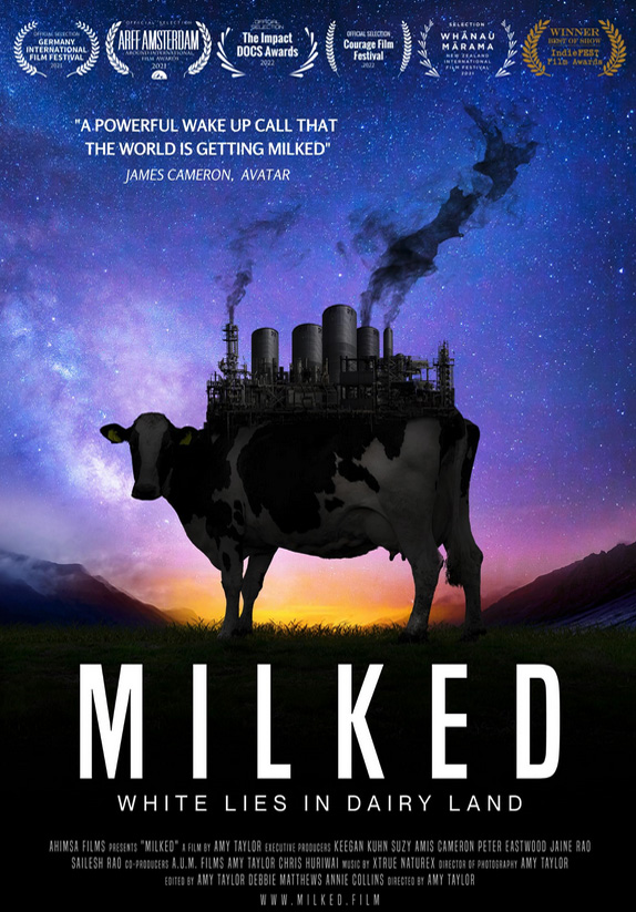 Milked movie poster shwoinga balck cow with a factory on her back